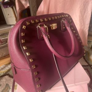 Michael Kors burgundy tote with Gold detail.